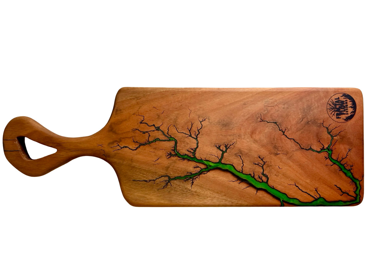 hardwood charcuterie board with a unique green design on a white background , resin board made in australia by fractal flow designs 