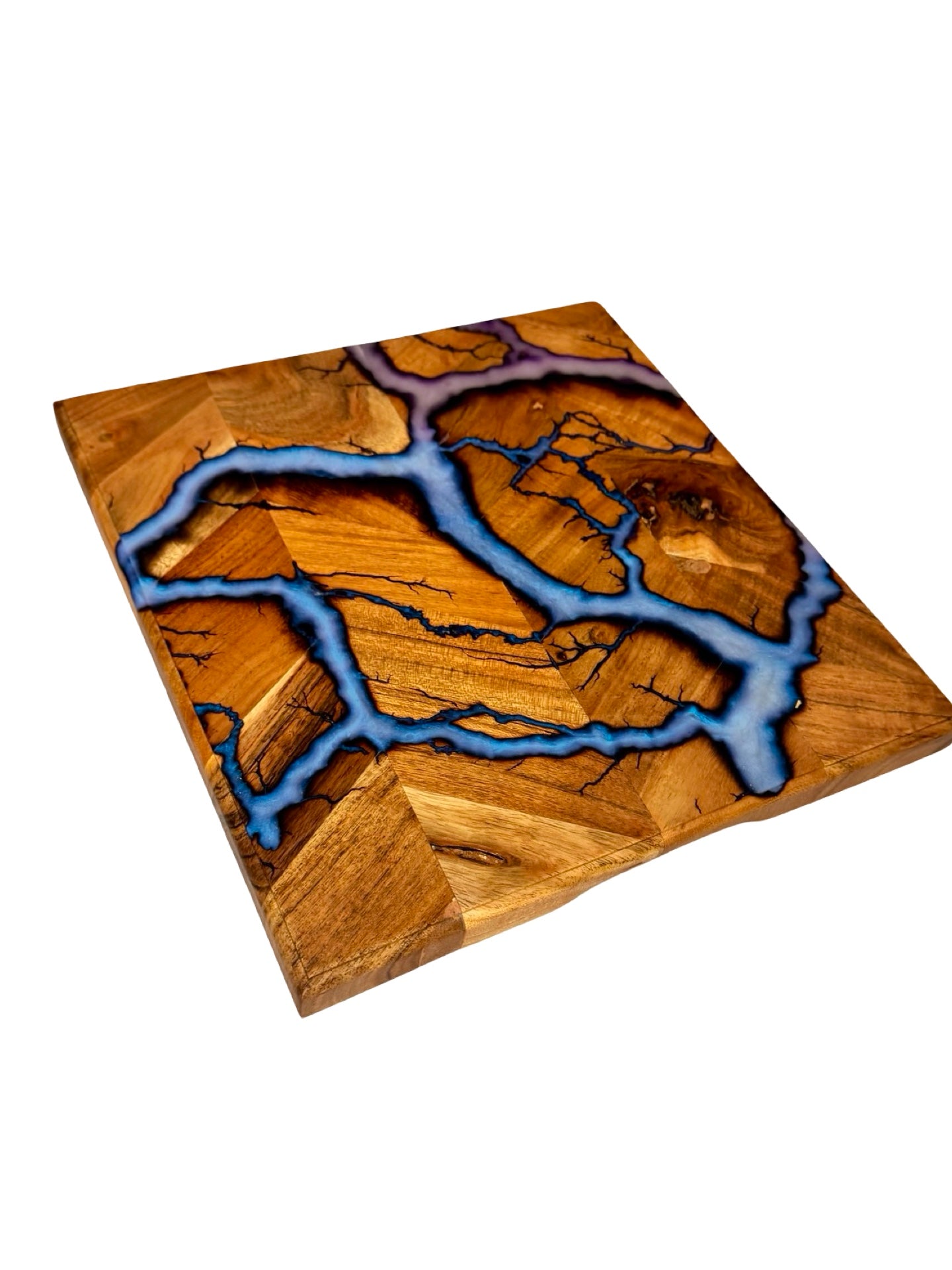 Handcrafted kitchen chopping board with iridescent blue resin flowing through fractal burned acacia timber grain, East Gippsland Australia, Fractal Flow Designs
