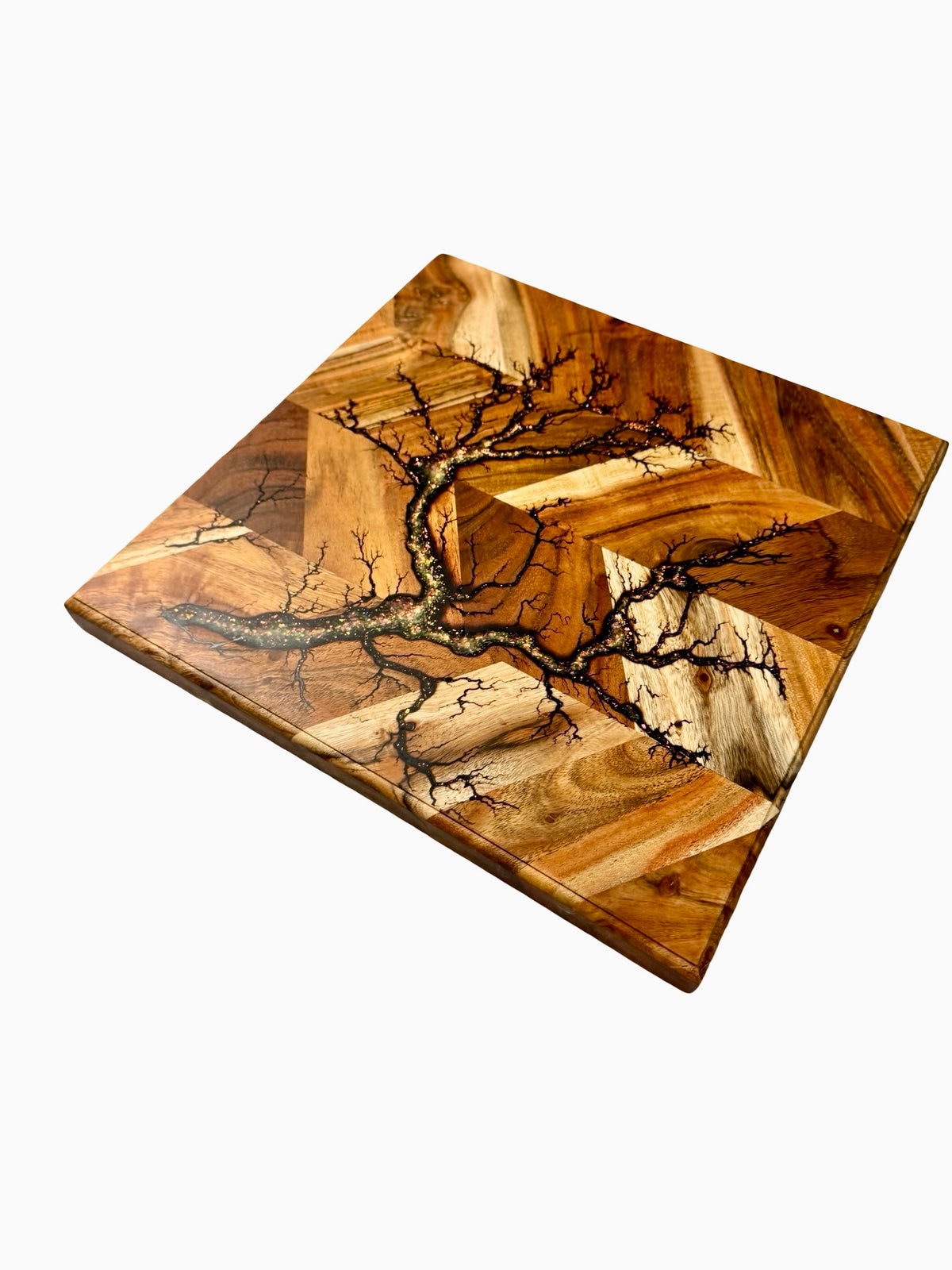 Handcrafted kitchen chopping board featuring glitter resin inlay flowing through fractal burned acacia timber grain, East Gippsland Australia, Fractal Flow Designs