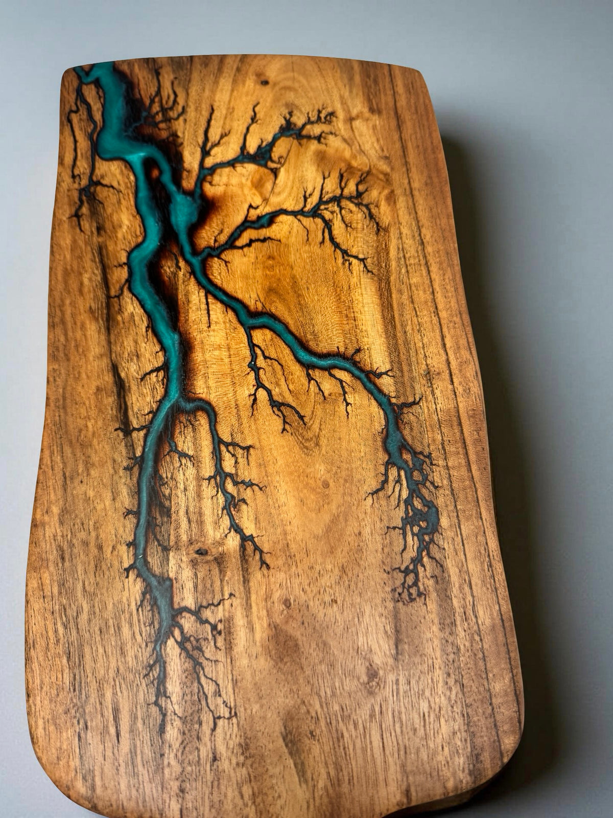 Handcrafted acacia paddle cheese board featuring deep green resin art and fractal burning lightning pattern, Australian resin boards East Gippsland, Fractal Flow Designs