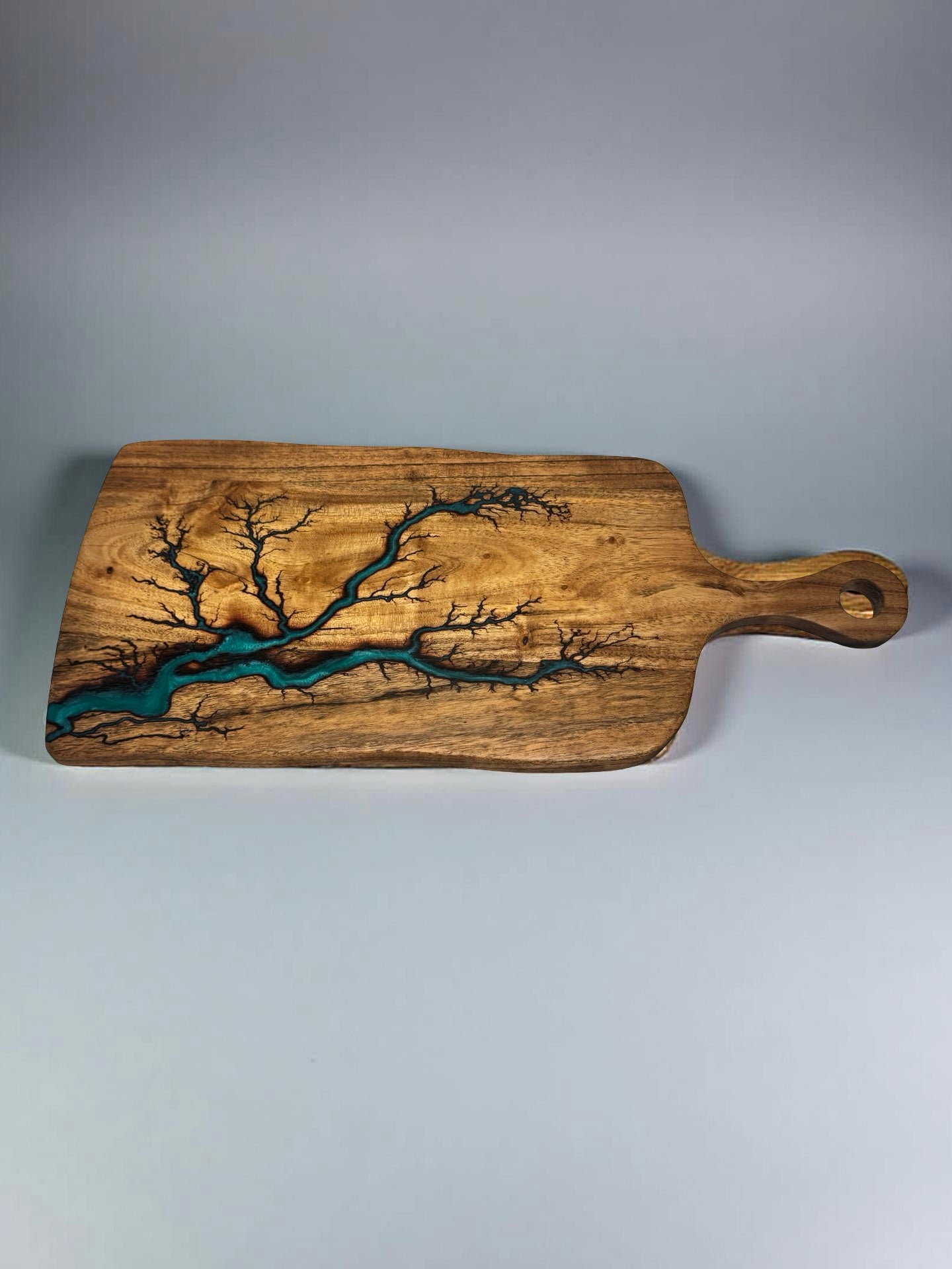 Fractal burned acacia timber paddle with green resin art flowing through the grain, artisan charcuterie serving board Australia, Fractal Flow Designs