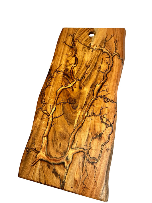 copper coloured resin inlayed after a fractal burn process on an acacia live edge board , large in size and made in Australia by fractal flow designs