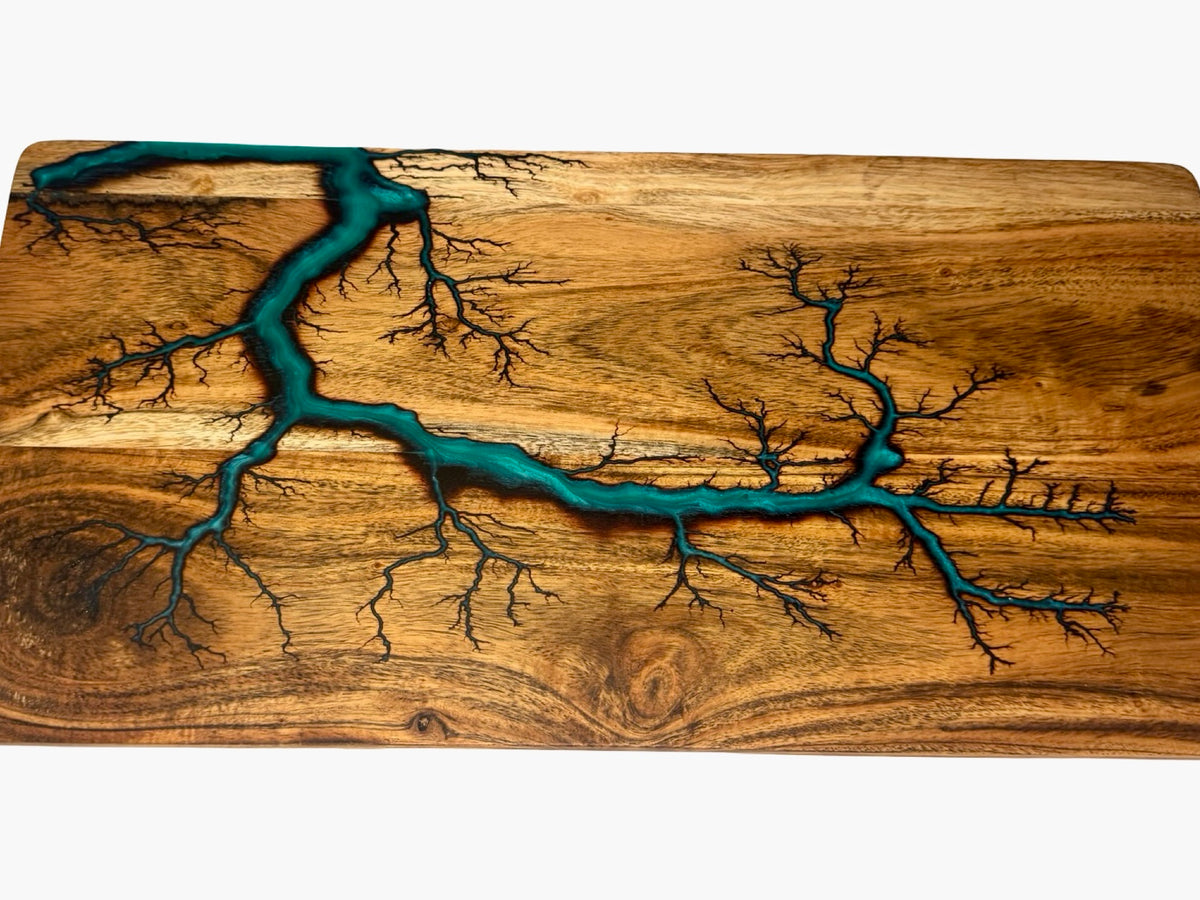 Handcrafted charcuterie serving board with marine green resin flowing through fractal burned acacia timber grain, East Gippsland Australia, Fractal Flow Designs