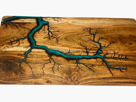 Handcrafted charcuterie serving board with marine green resin flowing through fractal burned acacia timber grain, East Gippsland Australia, Fractal Flow Designs