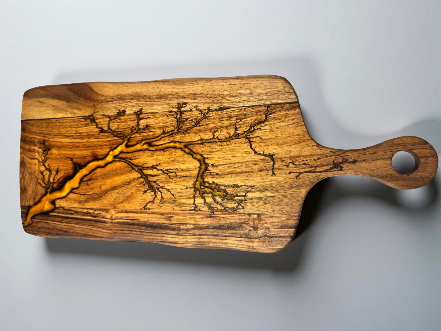 Orange resin charcuterie paddle board with fractal lightning burn design across acacia timber, premium resin boards Australia, Fractal Flow Designs