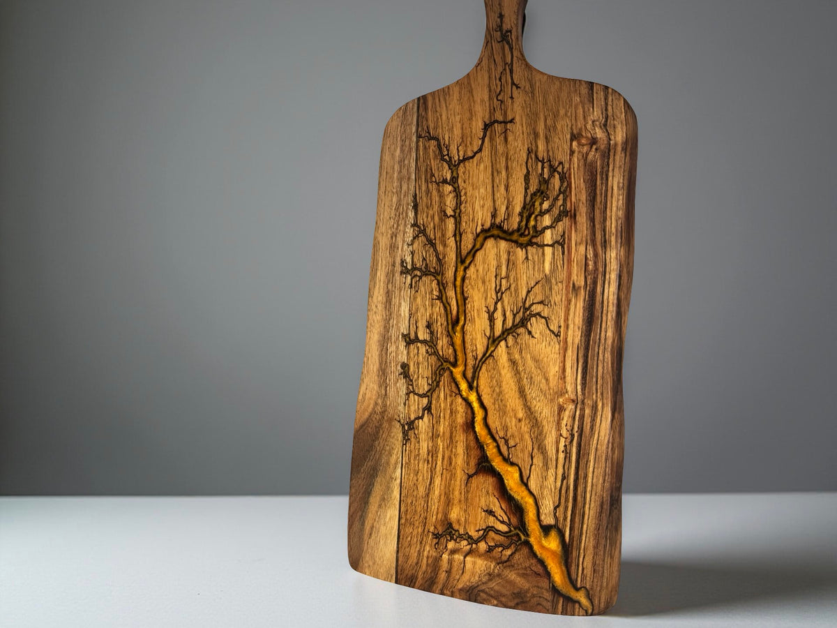 Handmade acacia serving paddle with bright orange resin river and fractal burning lightning pattern, artisan resin board East Gippsland Australia, Fractal Flow Designs