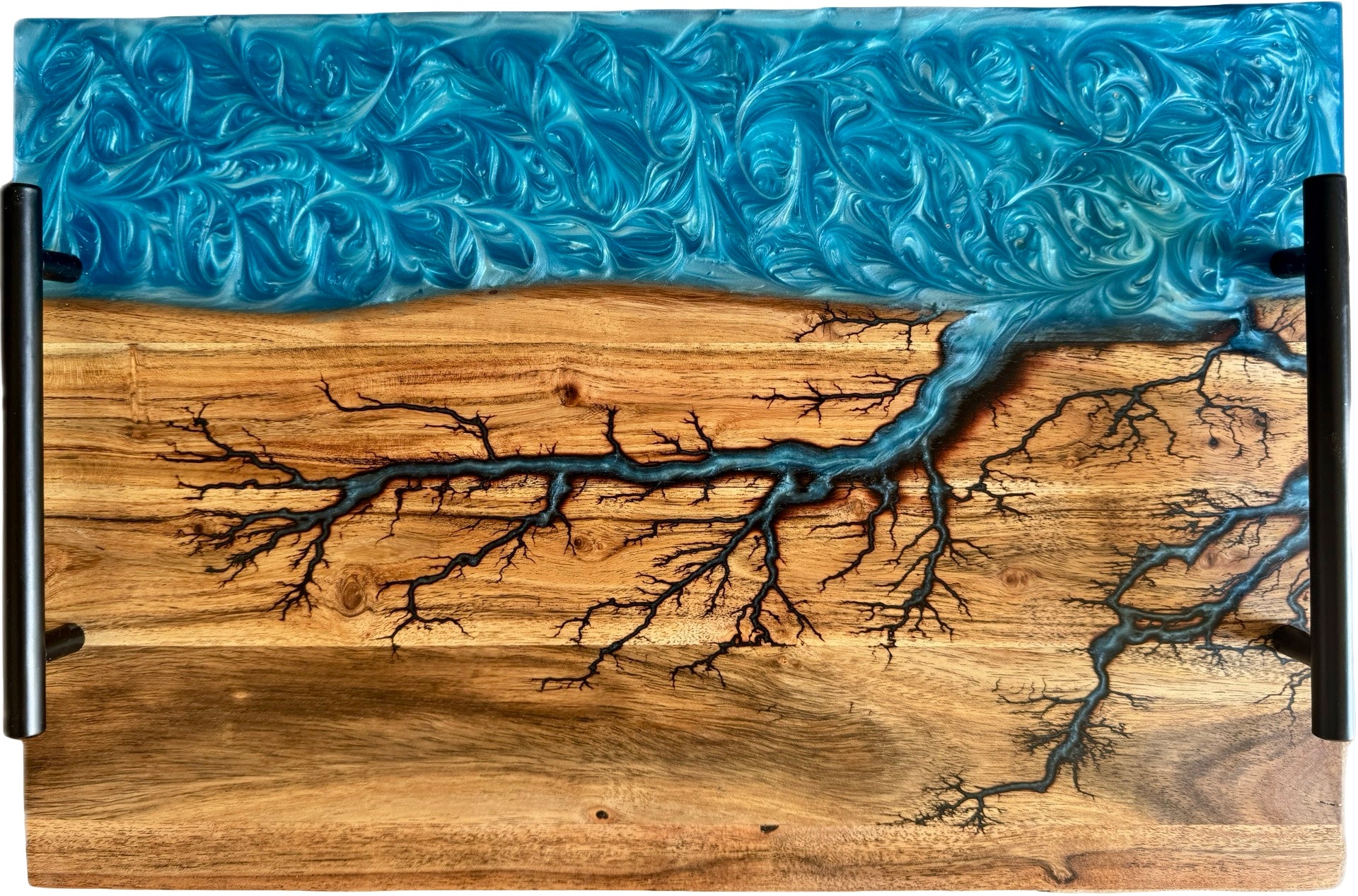 Australian handmade charcuterie board with sky blue resin river flowing through fractal burned acacia timber, fitted with black handles, Fractal Flow Designs