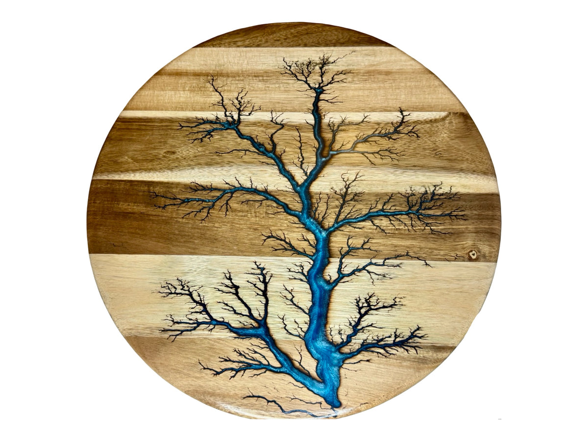 round  resin table centre piece with electic art made by fractal flow designs in victoria , australia featuring blue resin inlay