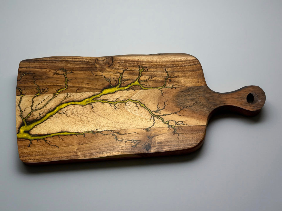 Yellow resin paddle cheese board with fractal burning lightning pattern on acacia timber, handcrafted serving board East Gippsland Australia, Fractal Flow Designs