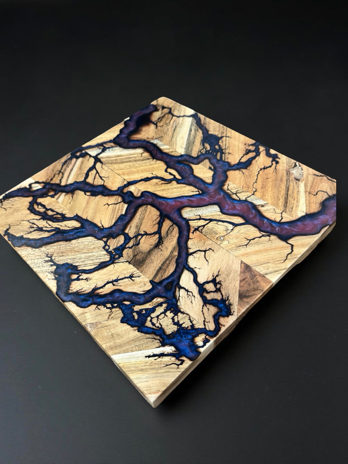 Australian timber chopping board 320 x 320 enhanced with red green chameleon resin movement and energetic fractal burning art produced in Bairnsdale Australia by Fractal Flow Designs Australia’s resin boards