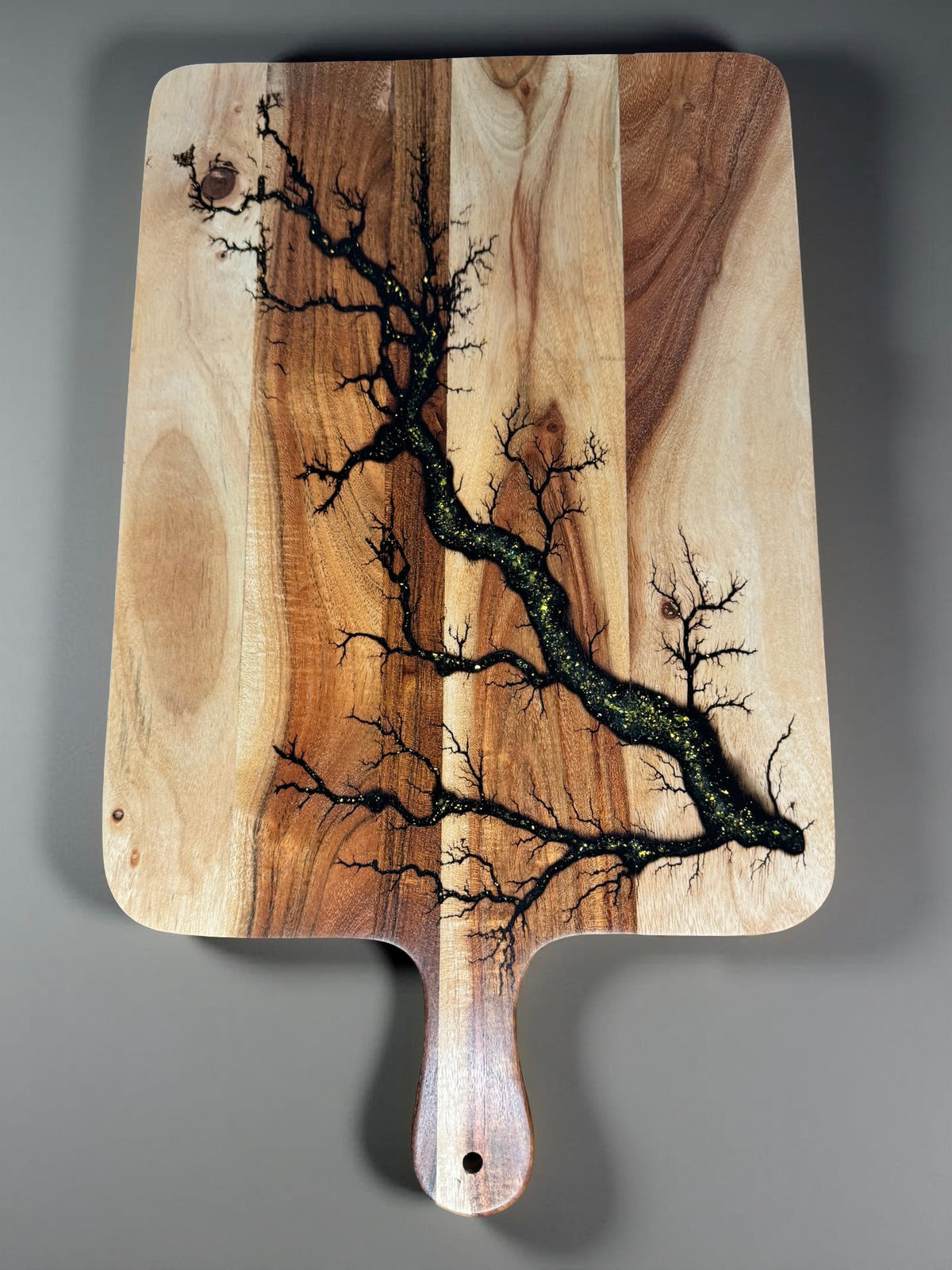 Gold sparkle resin cheese paddle board handcrafted from sustainable Australian timber by Fractal Flow Designs