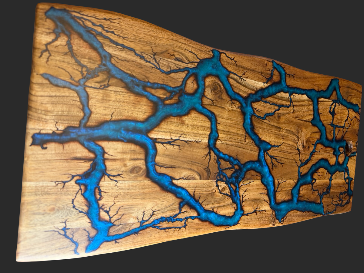 Turquoise resin serving board made with acacia timber featuring art made by electricity a true artisan art piece making it a functional art for home and parties, Australia wide shipping 