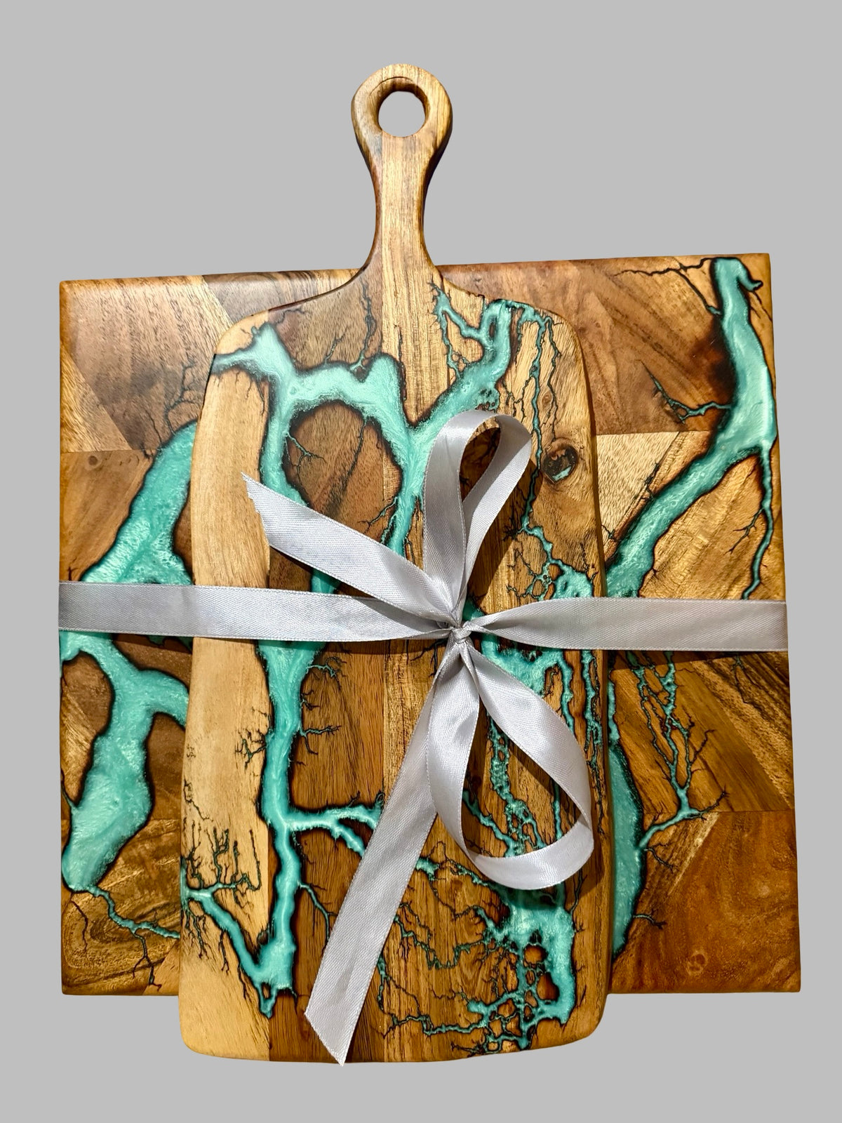 Gift set of two resin boards with teal resin art work , made in Australia by fractal flow designs resin boards