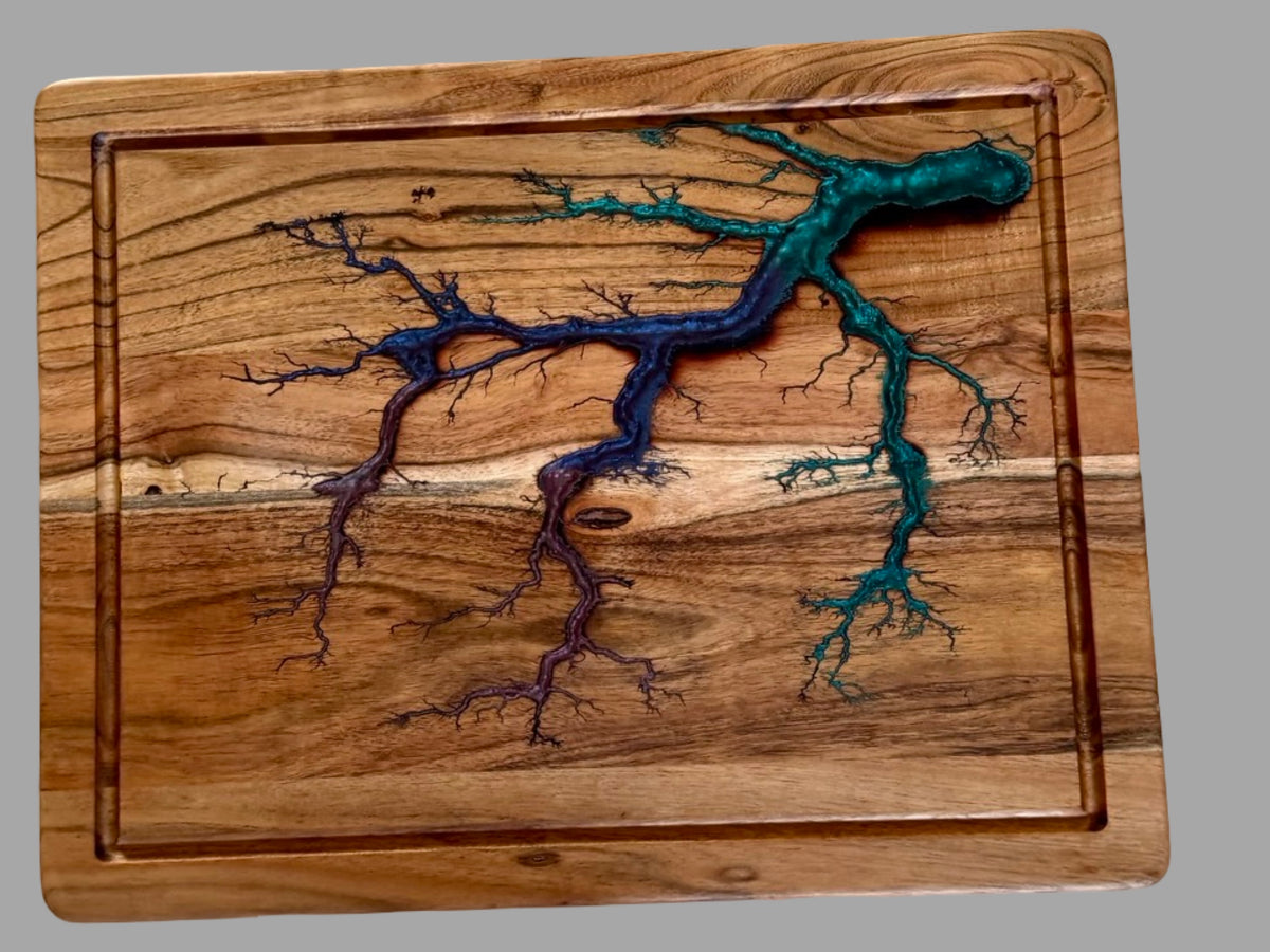     Handmade acacia cutting board featuring swirling blue, green and purple resin artwork with lightning inspired fractal burn details, luxury Australian serving and chopping board