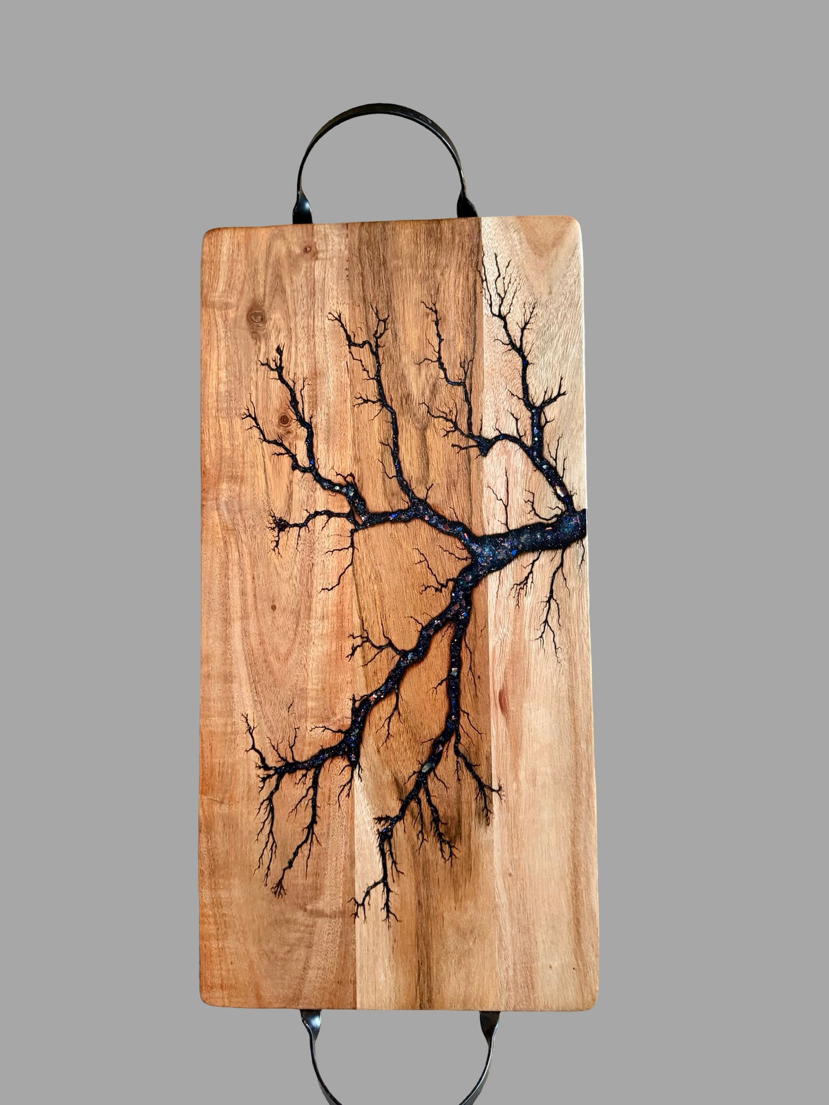 Premium Australian acacia serving board with black metal handles, vibrant blue sparkle resin inlay and handcrafted fractal burning, one of a kind grazing board