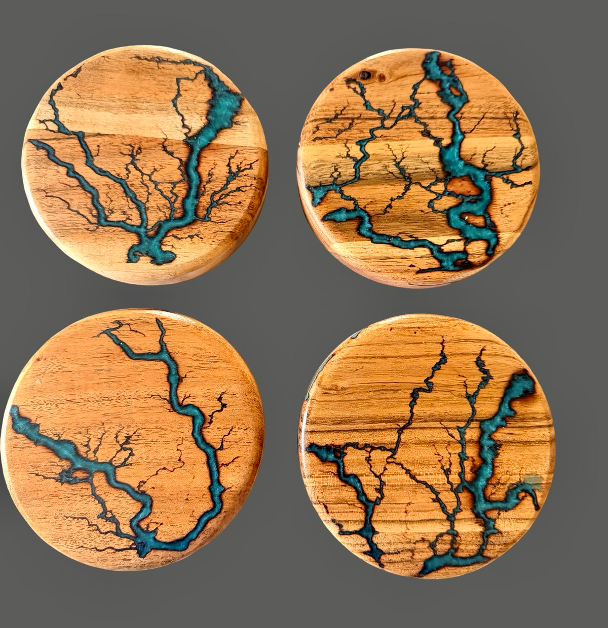 Australian acacia coaster set featuring marine green resin artwork and one of a kind fractal burning