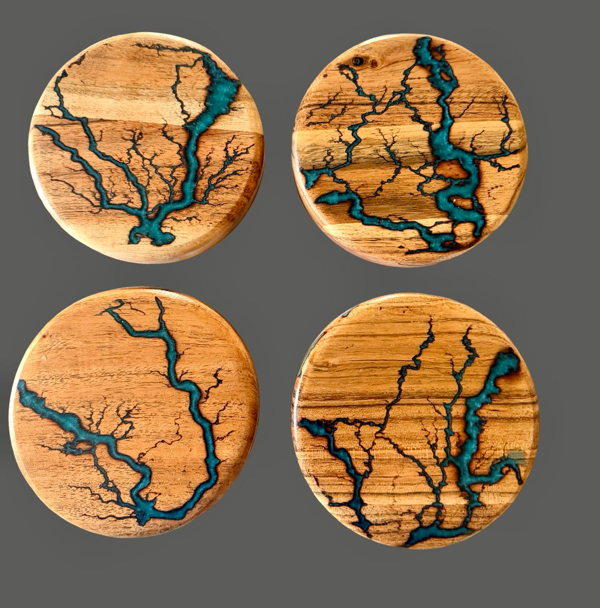 Set of four acacia coasters with marine green resin inlay and handcrafted fractal burning art pieces, Australian made by Fractal Flow Designs